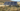 Front view of four solar panels powering a Perkinz solar water pump in a Central Otago paddock, delivering reliable off-grid water supply for farming.